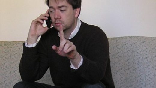 man sitting on couch