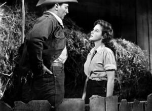 Robert Mitchum and Susan Hayward face off in a scene from "The Lusty Men" (1952)