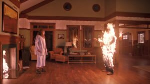 Still from the 2018 film "Hereditary" in which Annie's husband Steve is engulfed in flames.