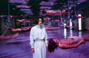 Dr. Wheeler (Genevieve Bujold) at the Hamilton Institute, where bodies are suspended both literally and biologically, until their organs are ready to be sold to the highest bidder, in the 1978 film "Coma"