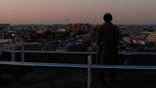 Takabe looking over the city, from the 1997 Kiyoshi Kurasawa film "Cure"